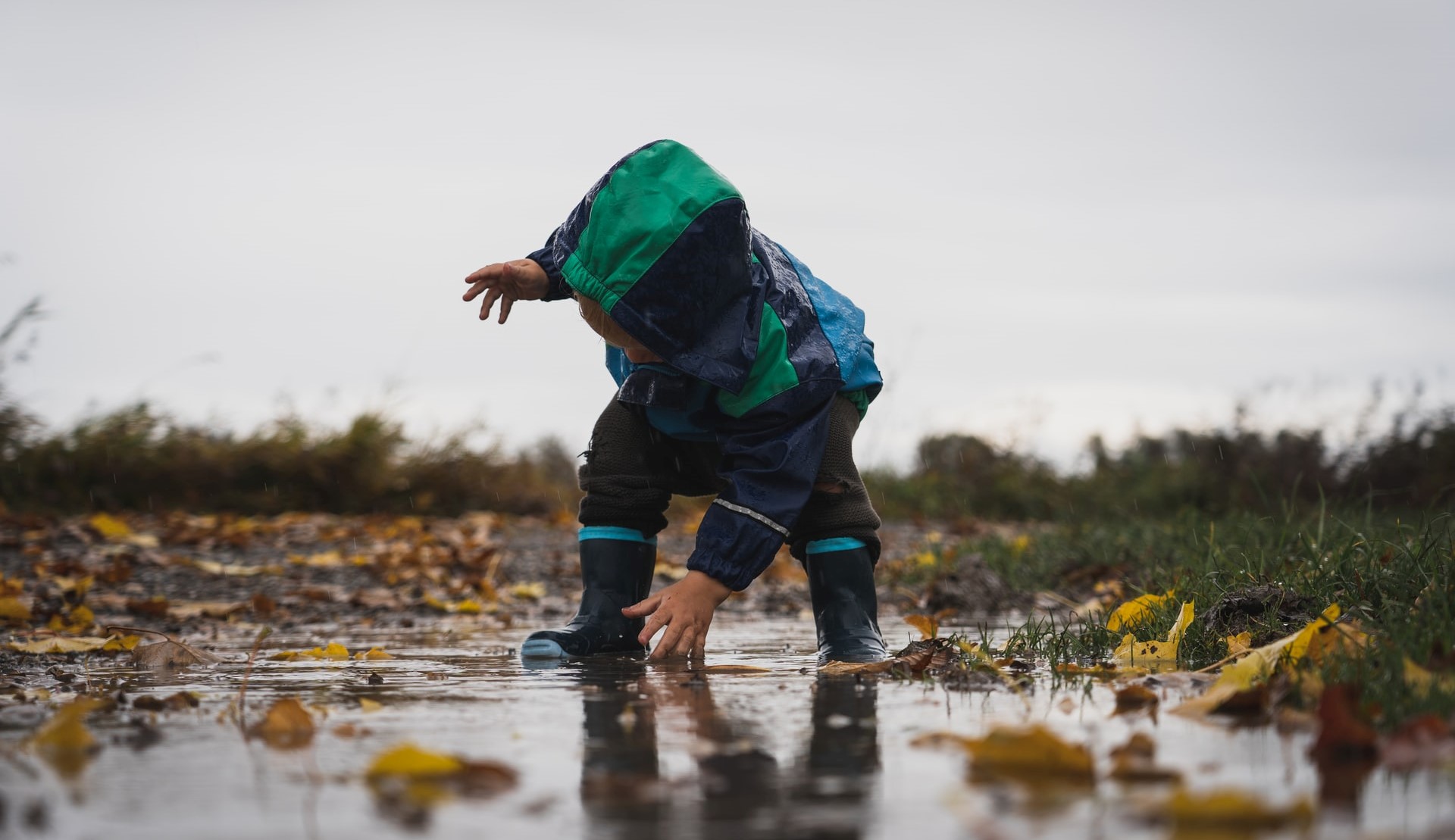 child in puddle
